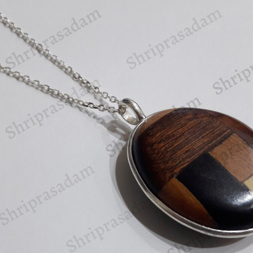 Pendant in 4 different types of wood with silver chain