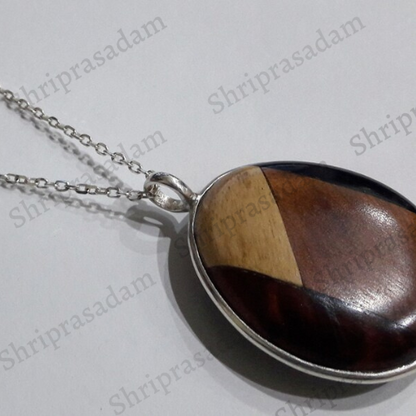 Pendant in 4 different types of wood with silver chain