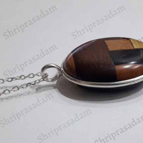 Pendant in 4 different types of wood with silver chain
